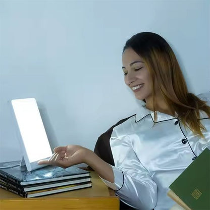 lampe luminotherapie femme lit lecture