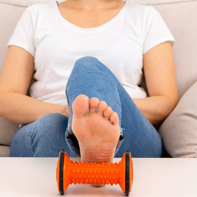 rouleau de massage orange pied femme detente plantaire
